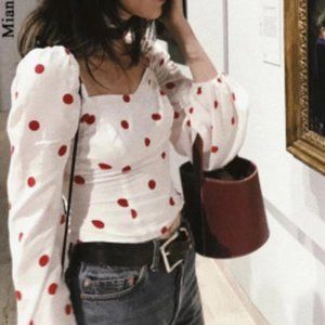 Corseted puffy sleeve polka dot top